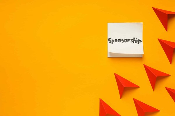 What legal steps are necessary for a UK company to sponsor international work visas?